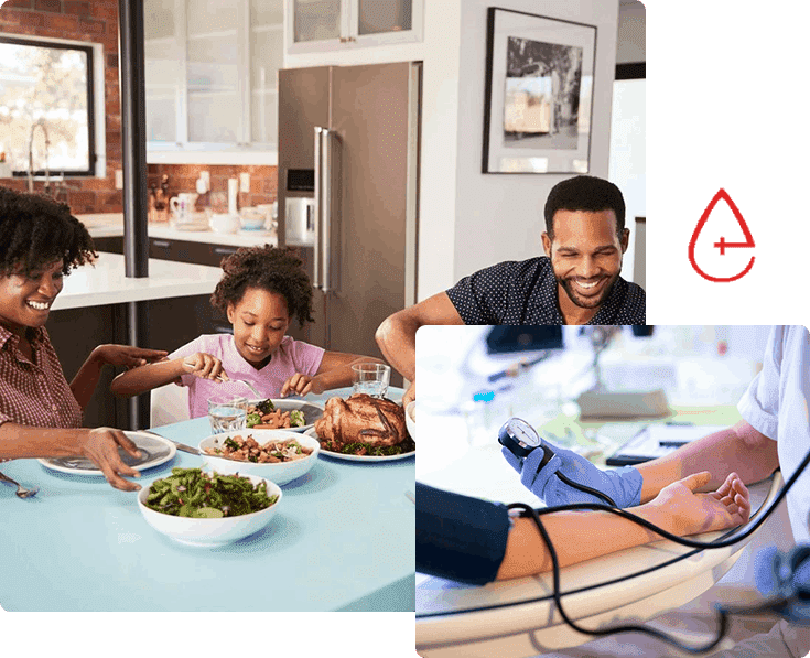 A family sitting at the table eating dinner.